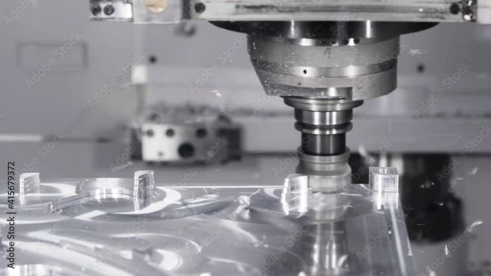 Automated Programmed CNC vertical milling machine with face mill shell endmill tool in process over aluminum metal piece, Industrial Factory 4k.