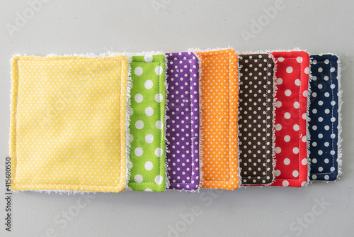 cotton reusable makeup remover wipes and colorful fabrics