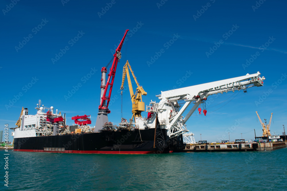 Cranes to repair boats in the bay of Cadiz capital, Andalusia. Spain. Europe. February 14, 2021