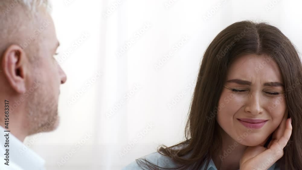 Female Patient Complaining Dentist Suffering From Toothache In Dental Clinic Female Patient Complaining Dentist Suffering From Toothache In Dental Clinic