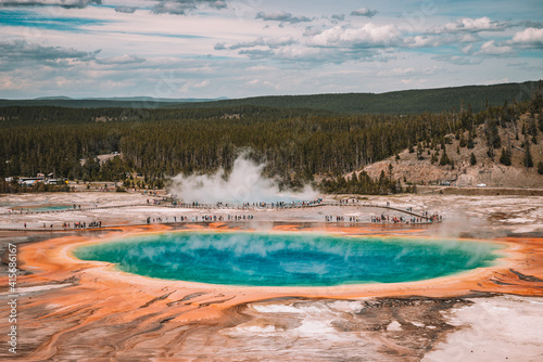 Tourists at grand prismatic spring, a view of grand prismatic spring from high vantage point, Yellowstone national Park, Wyoming