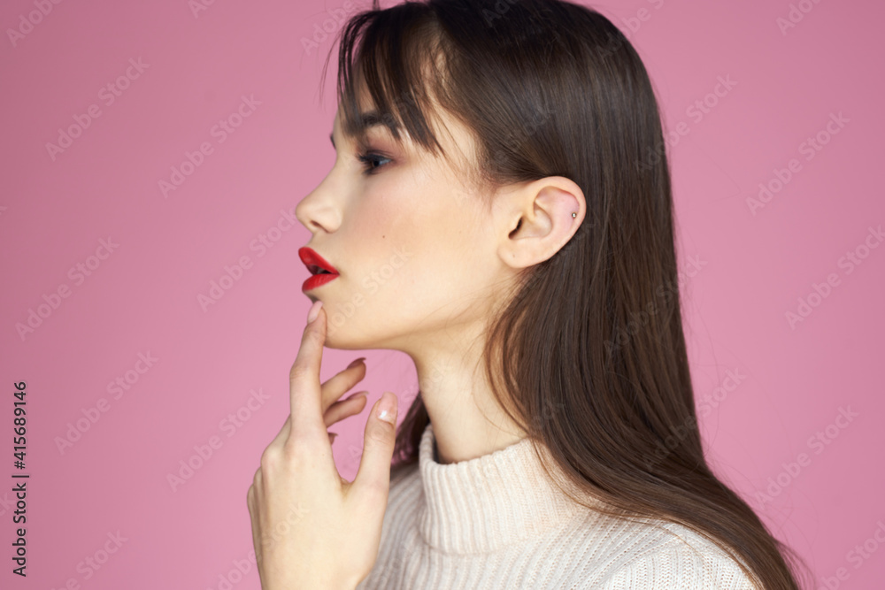 Beautiful brunette red lips white blouse close-up attractive view pink background Beautiful brunette red lips white blouse close-up attractive view pink background