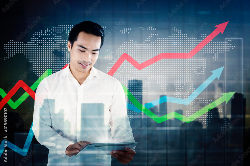 Businessman work with a tablet near upward arrows Businessman work with a tablet near upward arrows