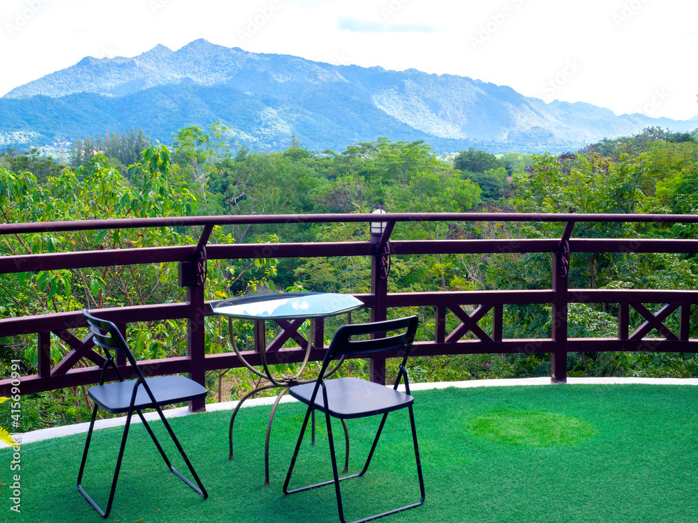 Green forest and mountain view background with empty table set on the terrace. Green forest and mountain view background with empty table set on the terrace.