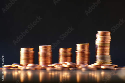 stack of coin on table background and business or finance saving money