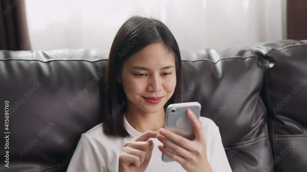 woman using smartphone, During leisure time. The concept of using the phone is essential in everyday life. woman using smartphone, During leisure time. The concept of using the phone is essential in everyday life.