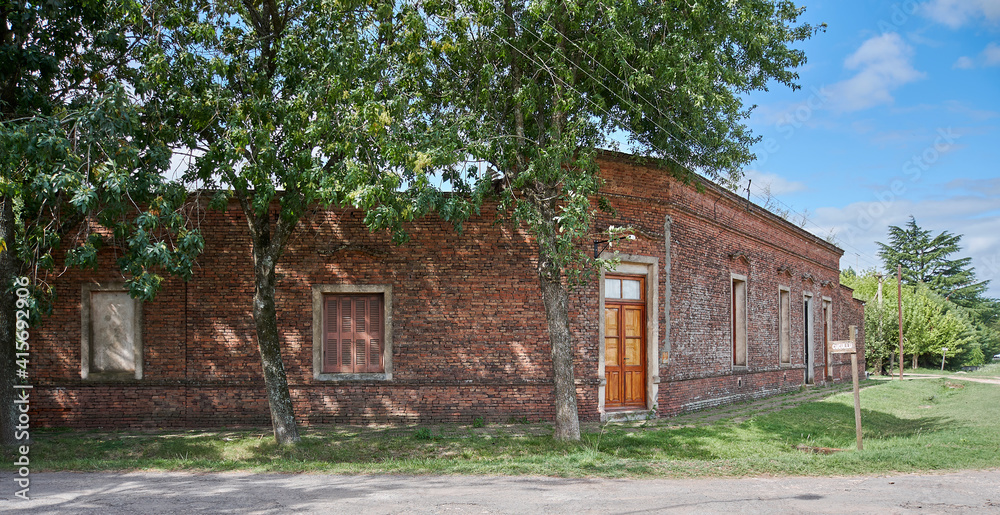 Corner with old country house with brick front door and window Corner with old country house with brick front door and window
