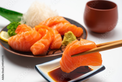 Sashimi, Salmon, Japanese food chopsticks and wasabi