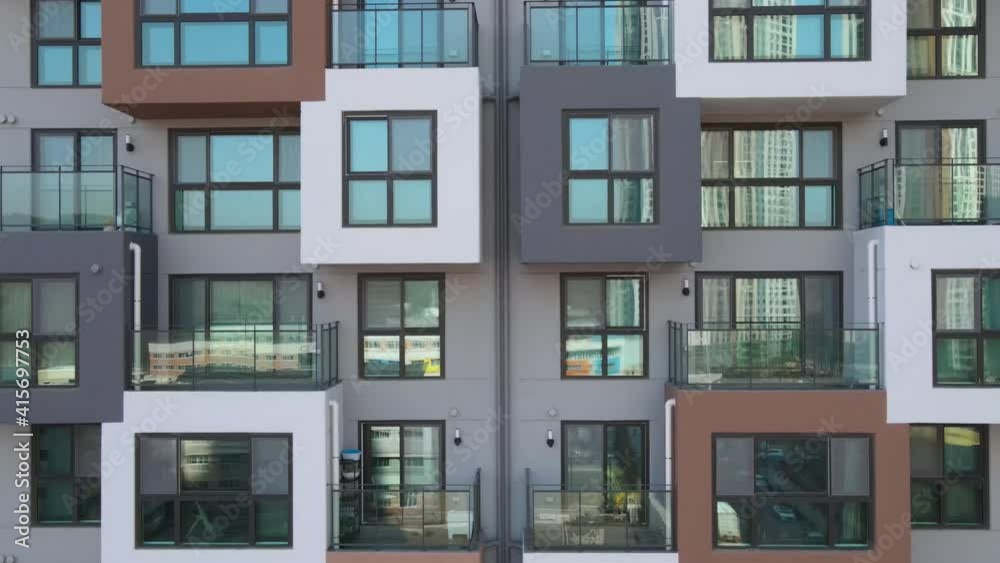 The modern building of residential complex close-up, urban geometry.