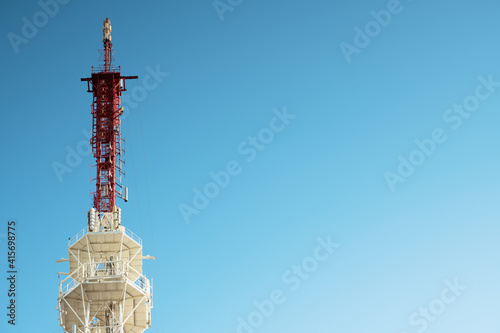 .Telecommunication tower against the blue sky, cell antenna, transmitter. TV tower