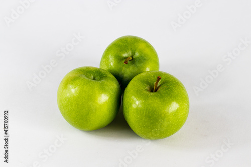 green apples on a white