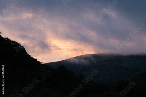 wide silhouette hill mountain clouds sunset night day