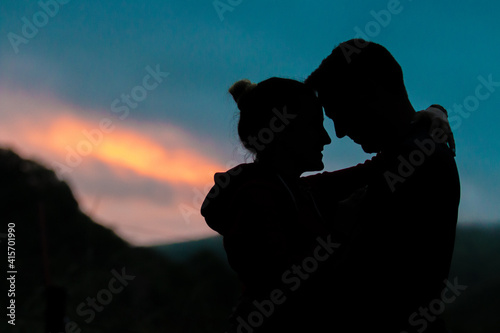 Beautiful Silhouette man woman african love sunset clouds nature