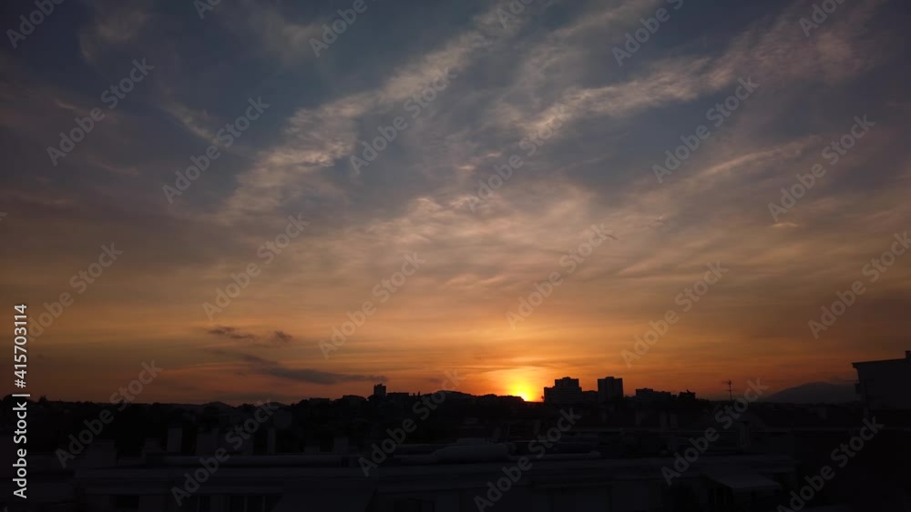 Motionlapse of beautiful cloudy sunset by skyline in southern France