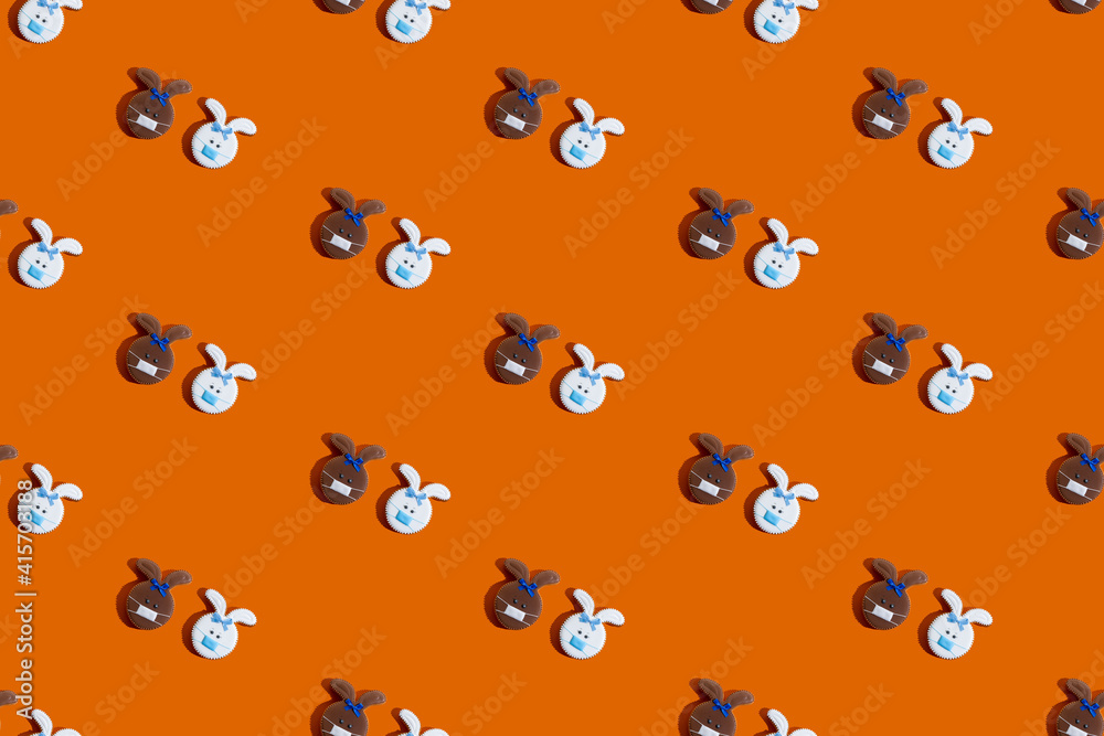 Pandemic background. Seamless pattern. Social distancing. Cute white brown bunny diverse couple in protective face mask creative minimal symmetrical ornament isolated on orange abstract banner. Pandemic background. Seamless pattern. Social distancing. Cute white brown bunny diverse couple in protective face mask creative minimal symmetrical ornament isolated on orange abstract banner.