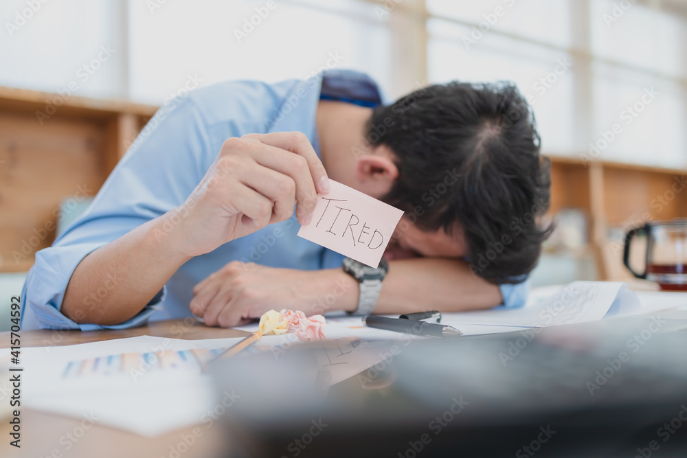 Businessman headache and hold sticky note with text Businessman headache and hold sticky note with text