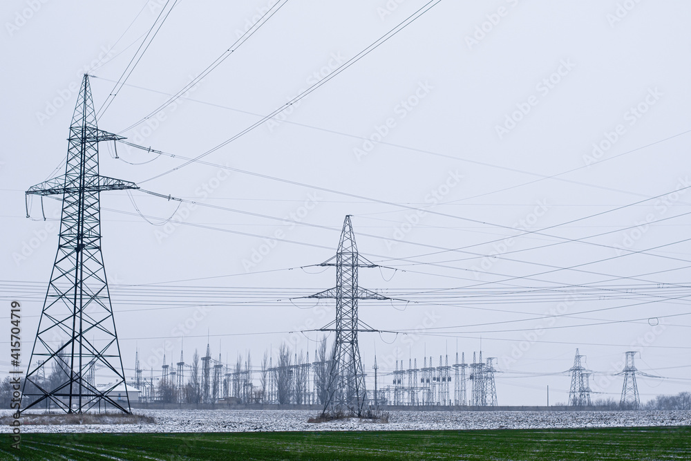transmission of large amounts of electricity. towers of high-voltage wires. High quality photo