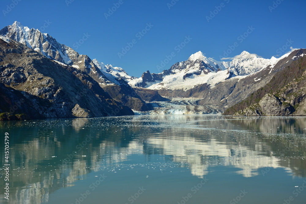 spectacular margerie glacier and surrounding mountain peaks of the fairweather range on a sunny summer day in glacier bay national park, southeast alaska