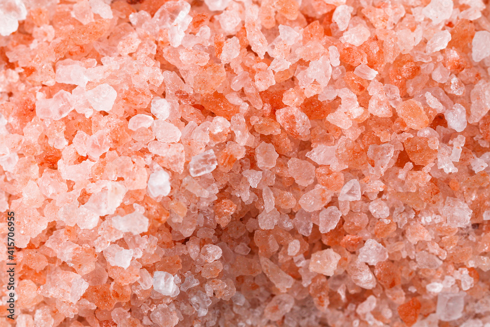 Pink coarse salt crystals on a blue table. Himalaya salt. Background for advertising salty. Pink coarse salt crystals on a blue table. Himalaya salt. Background for advertising salty.