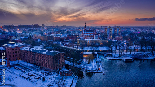 Bydgoszcz and frozen Brda river at dusk in winter, Poland