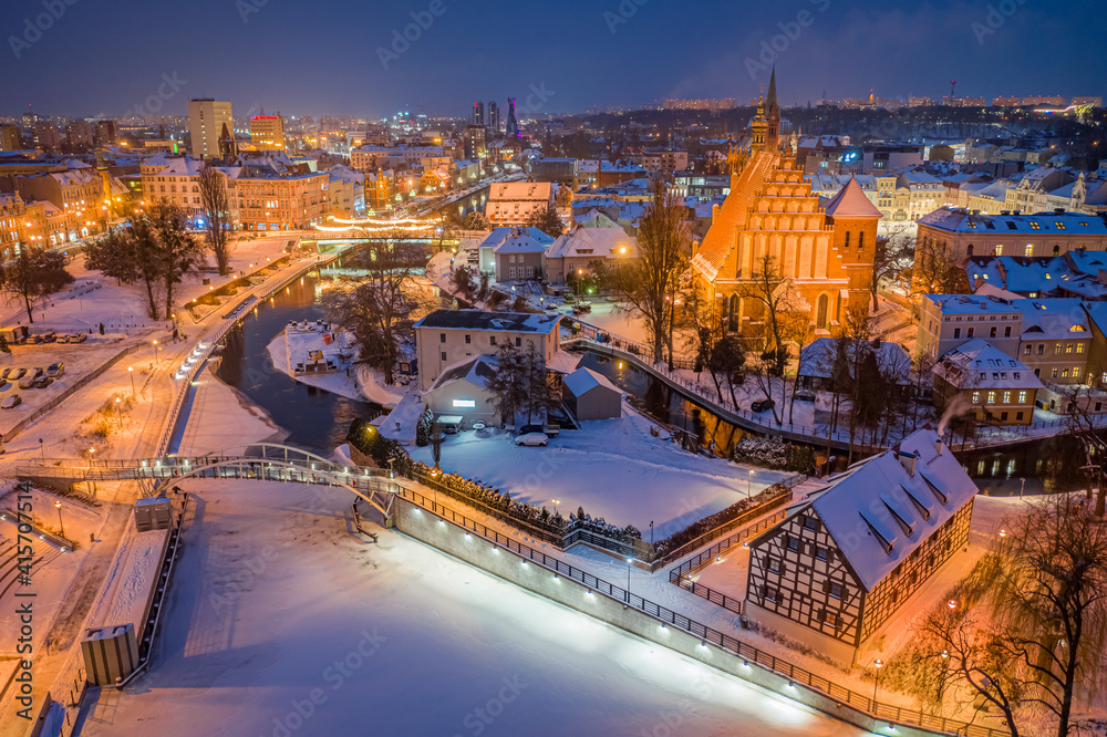 Fototapeta premium Aerial view of downtown Bydgoszcz at dusk in winter