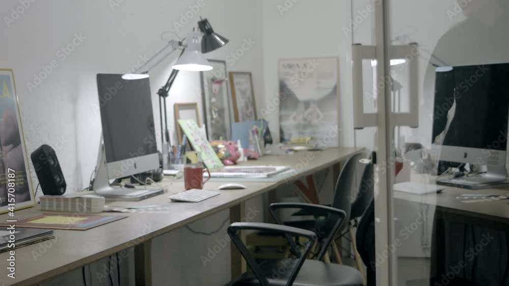 beautiful woman designer working in front of a computer with glasses beautiful woman designer working in front of a computer with glasses
