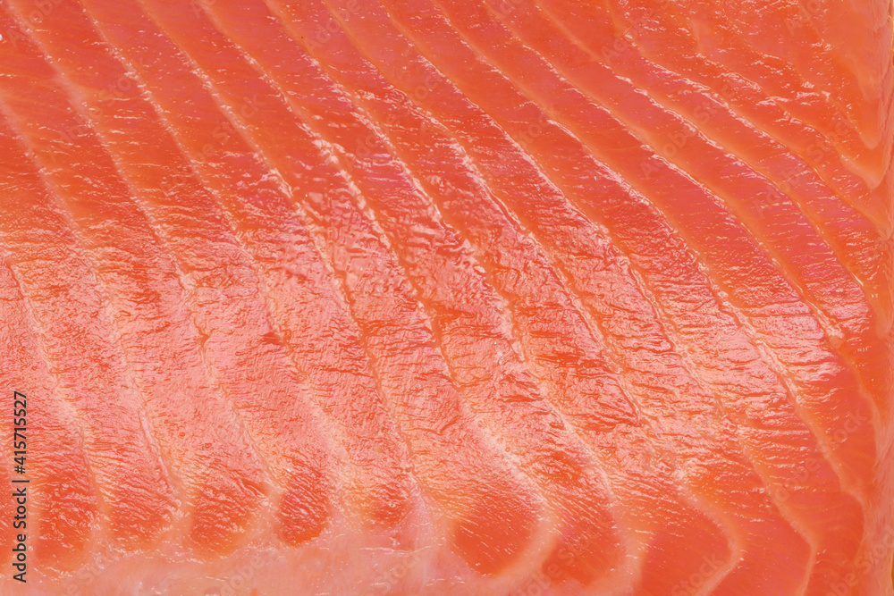 Fresh red salmon fillet slice texture or background Fresh red salmon fillet slice texture or background