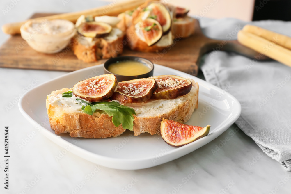 Tasty sandwich with fig on light background Tasty sandwich with fig on light background