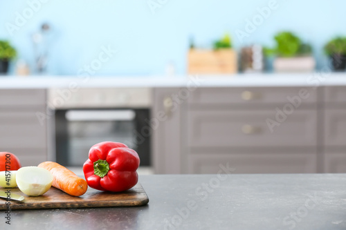 Fresh vegetables on table in modern kitchen