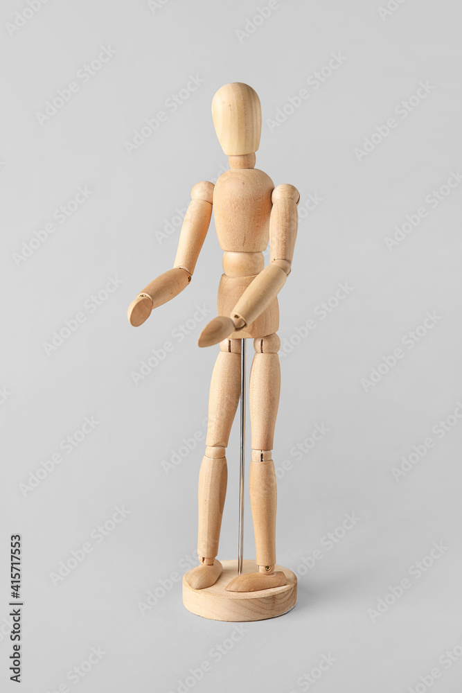Wooden mannequin on light background Wooden mannequin on light background
