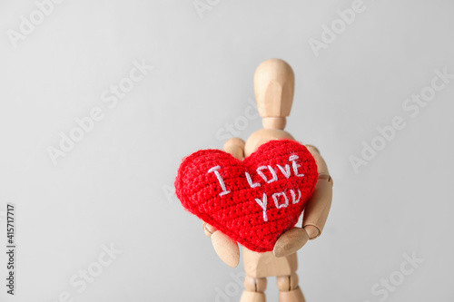 Wooden mannequin with heart...