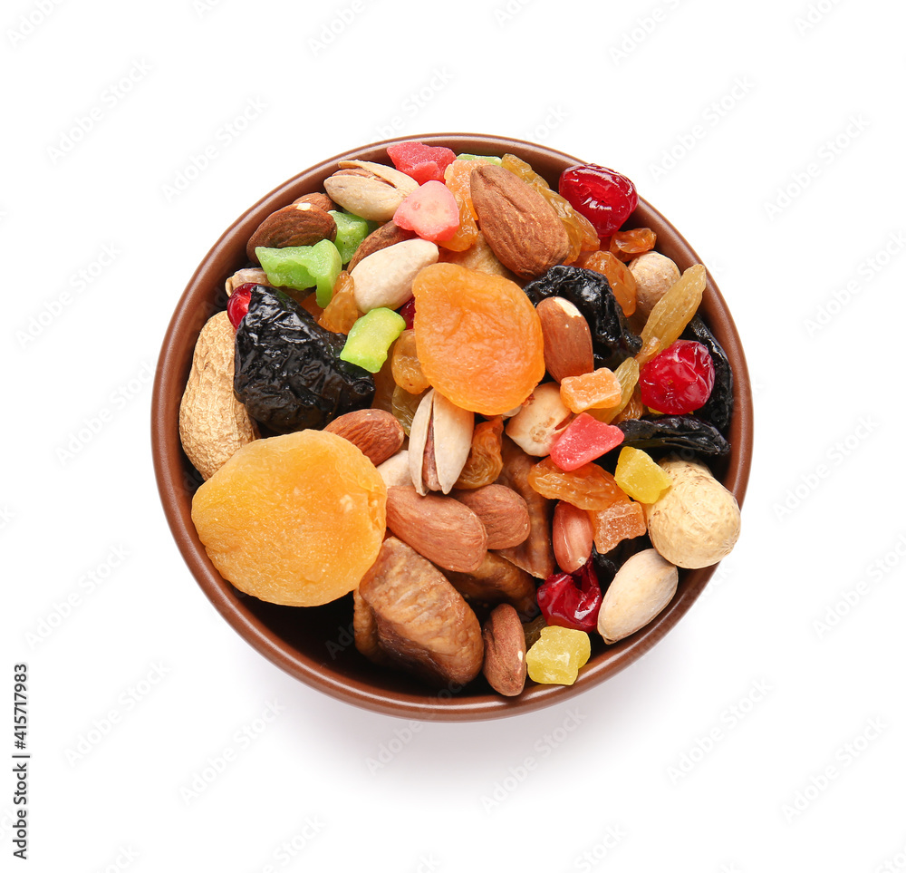 Bowl with different dried fruits on white background Bowl with different dried fruits on white background