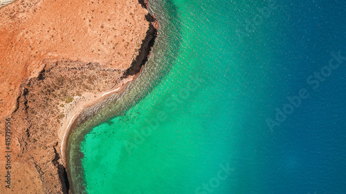 Aerial shot of blue-green waters in Isla del Espiritu Santo, Baja California Sur, Mexico