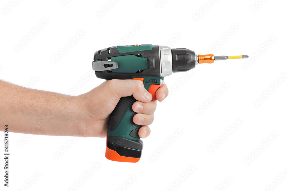 Electric drill or screwdriver in hand Electric drill or screwdriver in hand