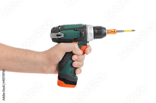 Electric drill or screwdriver in hand