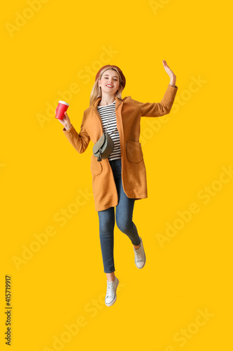 Jumping young woman on colo...