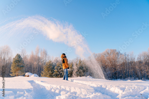 Photography The young man, with a sharp wave of his hand, pours hot water from a cup