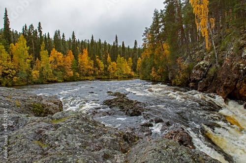 Famous Kiutaköngäs rapids at Oulanka Naional Park during autumn foliage. Kuusamo, Northern Finland, Europe