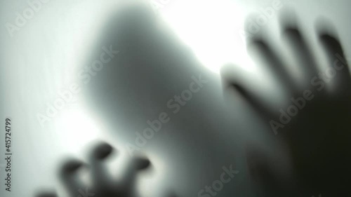Silhouette of Scary Man Behind Translucent Glass Scratching the Surface