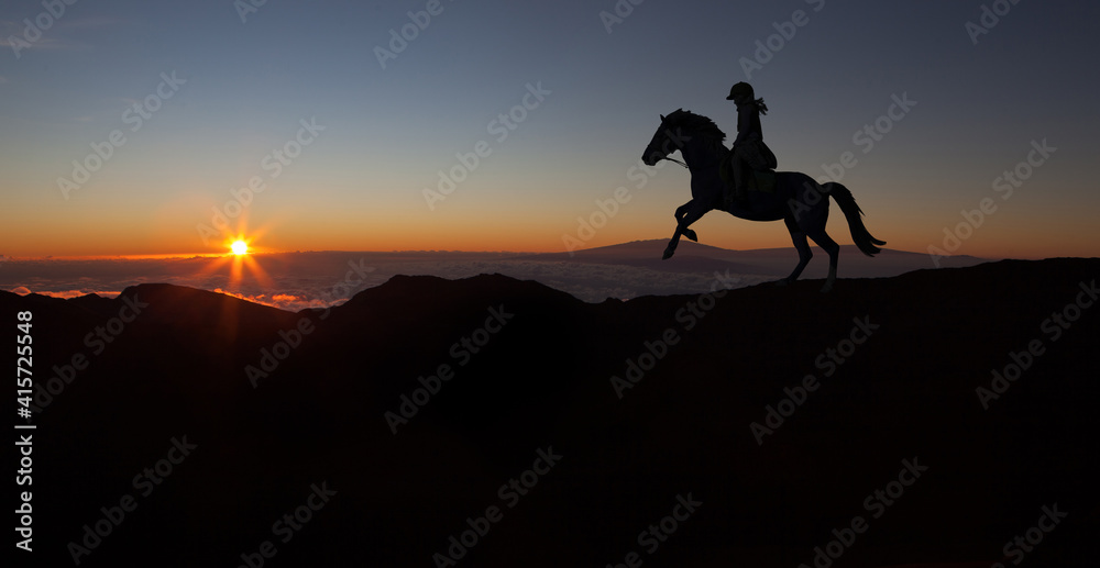 Sports girl riding a horse at countryside in a field, isolated image, black silhouette on a sunset background, against morning sky