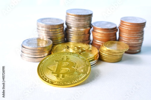 Stack of coins, Bitcoin and other coins that are placed together.  Picture in the concept of finance and economy. photo