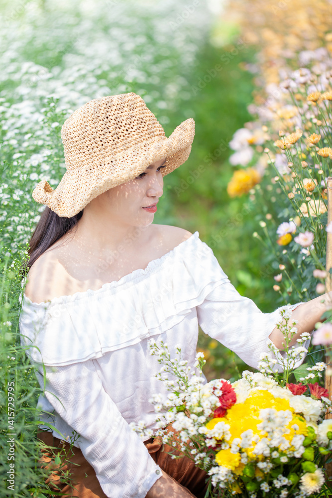 Beautiful asian woman in the flower garden