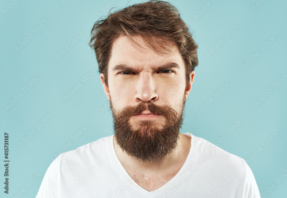 Obraz premium aggression stress man with a beard emotions indignant look fist