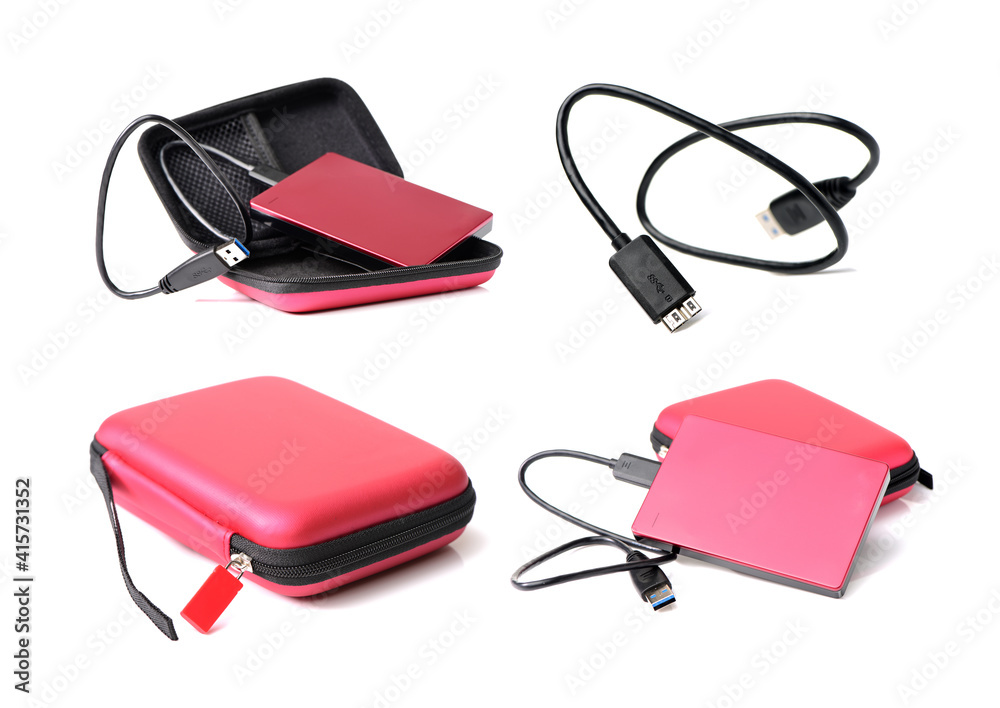 Red external hard drive with usb cable on the white background Red external hard drive with usb cable on the white background