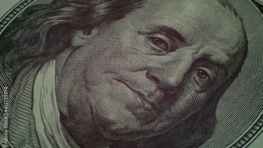 Benjamin Franklin face on one hundred dollars banknote of american money slow rotating. Extreme close-up portrait of president Franklin. Moving on circle. Slow motion. Background.