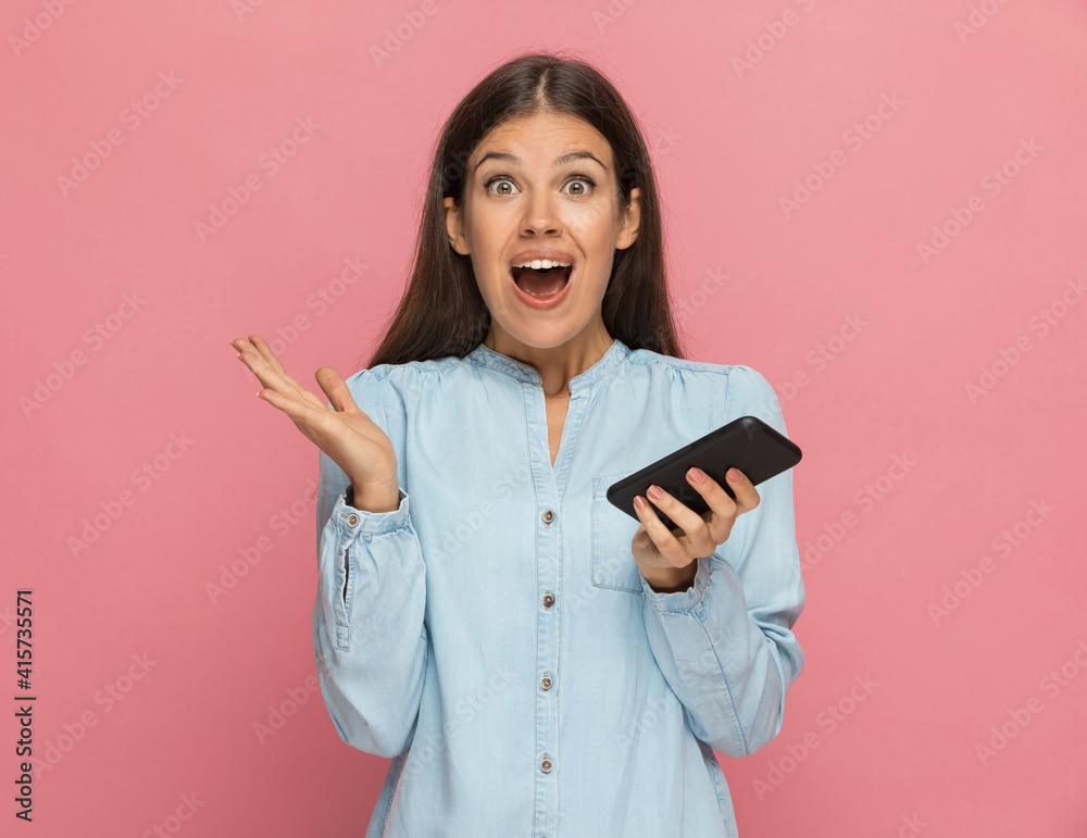 casual woman feeling surprised after a message on her phone casual woman feeling surprised after a message on her phone