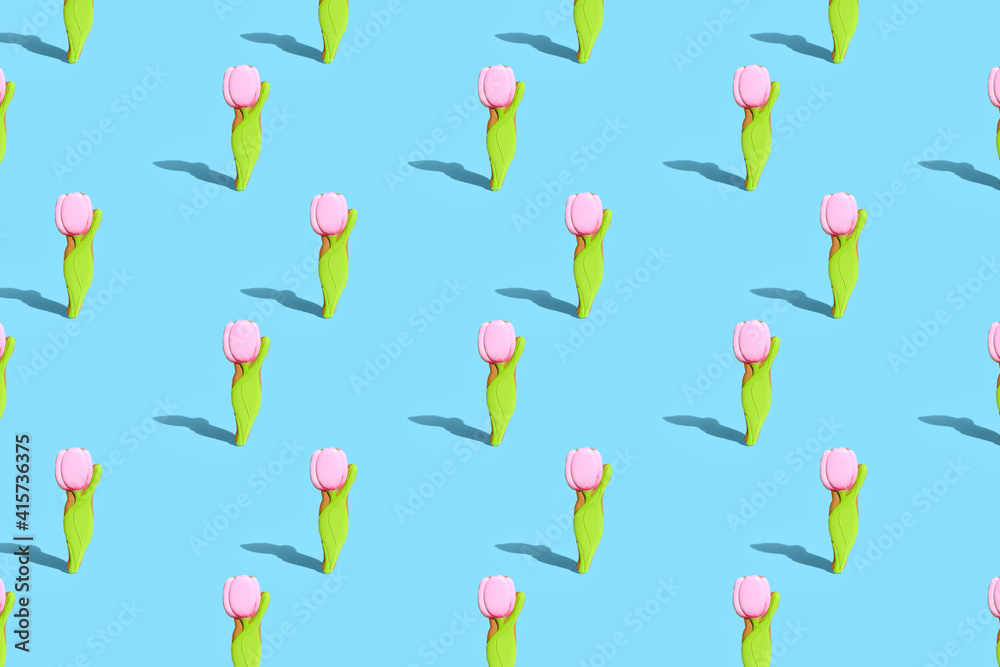 . Creative design card. Gingerbread in the form of a tulip on a blue bright background. The concept of celebrating Women's Day, Valentine's Day. Pattern. . Creative design card. Gingerbread in the form of a tulip on a blue bright background. The concept of celebrating Women's Day, Valentine's Day. Pattern.