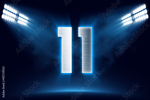 Number 11 background, 3D 11 object made of metal, illuminated with floodlights