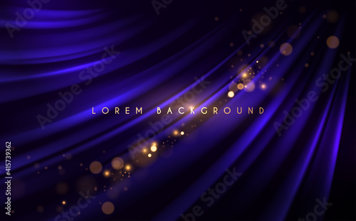 Abstract blue silk background with gold glow effect