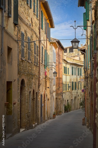 Narrow street with medieval houses  Montalcino  Italy
